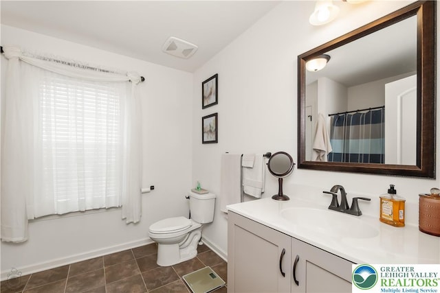 1043 Lisa Ln, Palmer Twp, PA 18045 - full bath with vanity, toilet, baseboards, and tile patterned floors