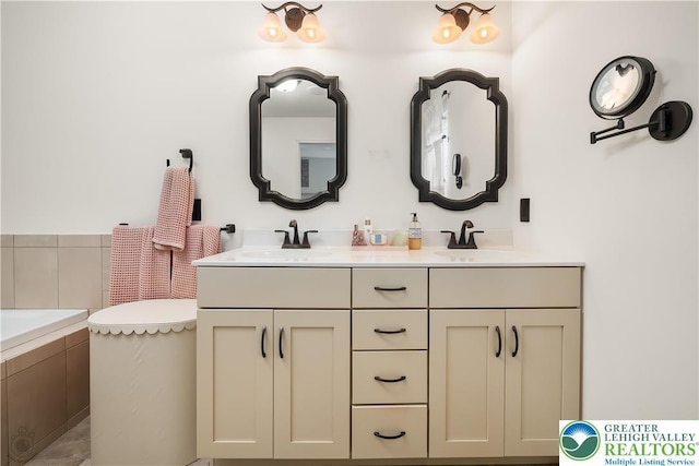 1043 Lisa Ln, Palmer Twp, PA 18045 - bathroom with double vanity and tiled tub