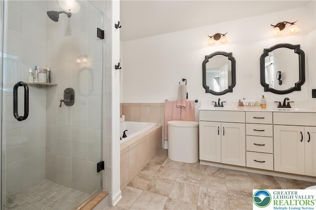 1043 Lisa Ln, Palmer Twp, PA 18045 - bathroom featuring double vanity, a stall shower, and a garden tub