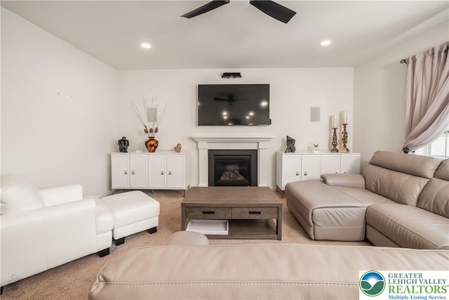 1043 Lisa Ln, Palmer Twp, PA 18045 - carpeted living room featuring ceiling fan, a glass covered fireplace, and recessed lighting