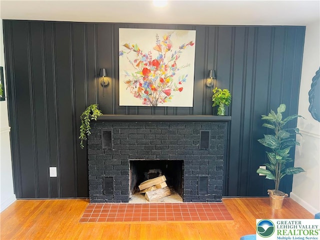 818 W Station Ave, Coopersburg Borough, PA 18036 - detailed view of wood finished floors, a brick fireplace, and baseboards