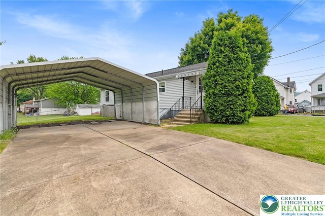 4 Davis St, Luzerne, PA 18706 - view of front facade featuring a carport and concrete driveway