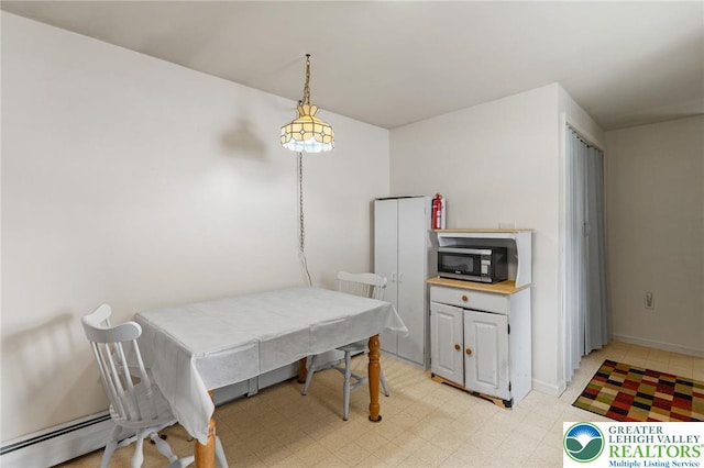 4 Davis St, Luzerne, PA 18706 - dining space with a baseboard heating unit and baseboards