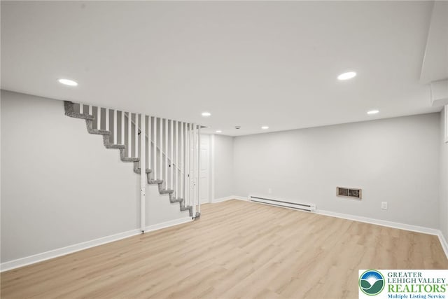541 Elm St, Emmaus Borough, PA 18049 - finished below grade area featuring baseboard heating, wood finished floors, recessed lighting, baseboards, and stairway