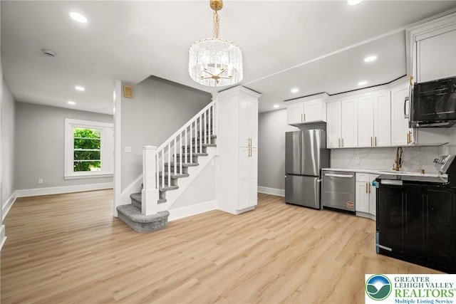541 Elm St, Emmaus Borough, PA 18049 - kitchen with stainless steel appliances, baseboards, light wood-style flooring, and recessed lighting