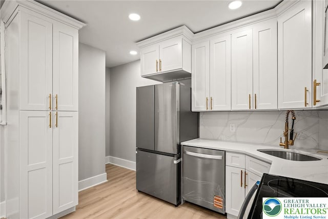 541 Elm St, Emmaus Borough, PA 18049 - kitchen featuring stainless steel appliances, a sink, recessed lighting, baseboards, and tasteful backsplash