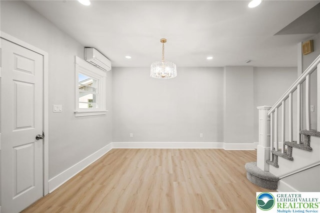 541 Elm St, Emmaus Borough, PA 18049 - interior space with a wall unit AC, light wood-type flooring, stairs, recessed lighting, and baseboards