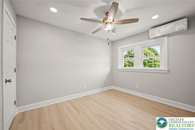 541 Elm St, Emmaus Borough, PA 18049 - spare room with a wall mounted air conditioner, light wood-style flooring, ceiling fan, baseboards, and recessed lighting