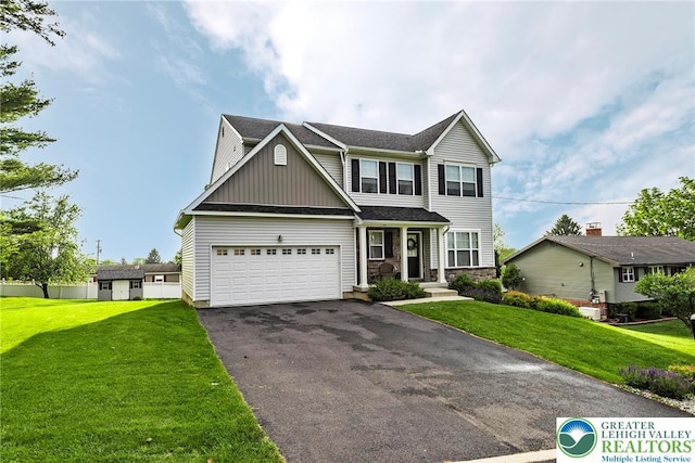 1404 Waverly Ave, Easton, PA 18040 - view of front of home featuring driveway, board and batten siding, stone siding, and a front lawn