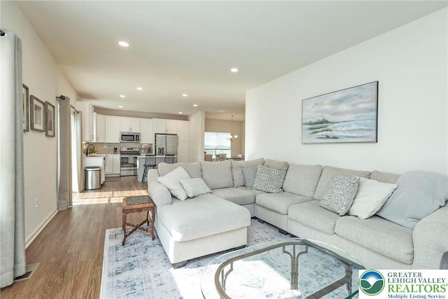 1404 Waverly Ave, Easton, PA 18040 - living area featuring wood finished floors, recessed lighting, and baseboards
