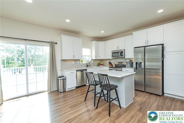 1404 Waverly Ave, Easton, PA 18040 - kitchen featuring appliances with stainless steel finishes, a sink, a center island, light countertops, and recessed lighting