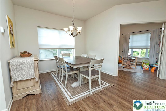 1404 Waverly Ave, Easton, PA 18040 - dining area featuring dark wood-style flooring, a chandelier, plenty of natural light, and vaulted ceiling