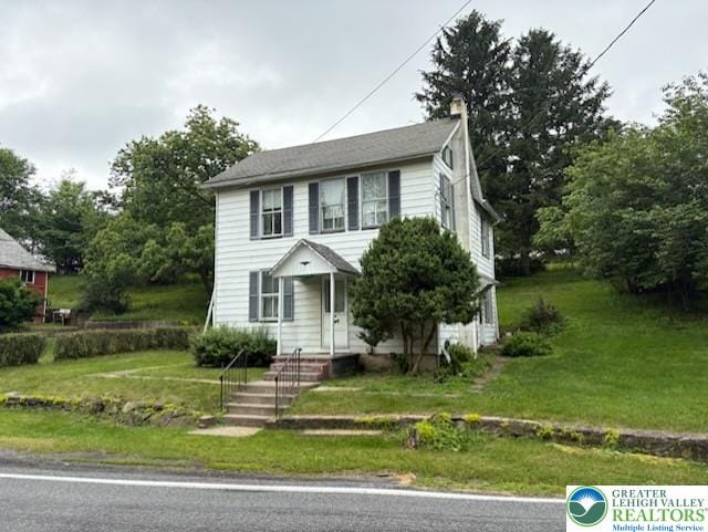 2530 5th Street, St, PA 18014 - view of front facade featuring a front yard and a chimney