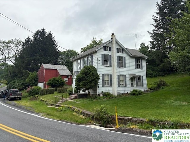 2530 5th Street, St, PA 18014 - view of front of home featuring a chimney, a front lawn, and an outbuilding