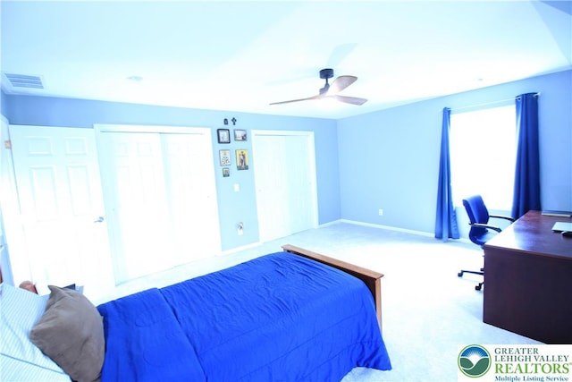 472 Bauer Rd, Moore Twp, PA 18014 - carpeted bedroom featuring an office area, ceiling fan, baseboards, and two closets