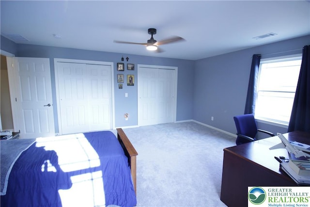 472 Bauer Rd, Moore Twp, PA 18014 - unfurnished bedroom featuring two closets, carpet floors, a desk, baseboards, and a ceiling fan