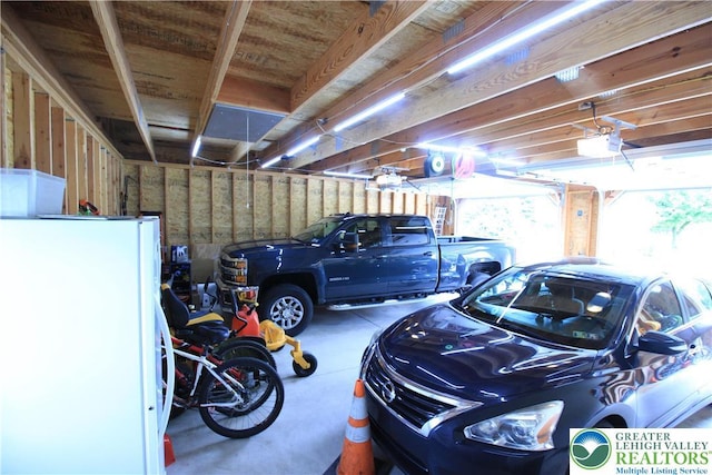 472 Bauer Rd, Moore Twp, PA 18014 - garage featuring freestanding refrigerator and a garage door opener