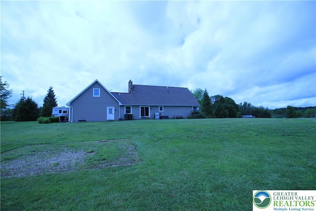 472 Bauer Rd, Moore Twp, PA 18014 - rear view of property with a chimney and a lawn