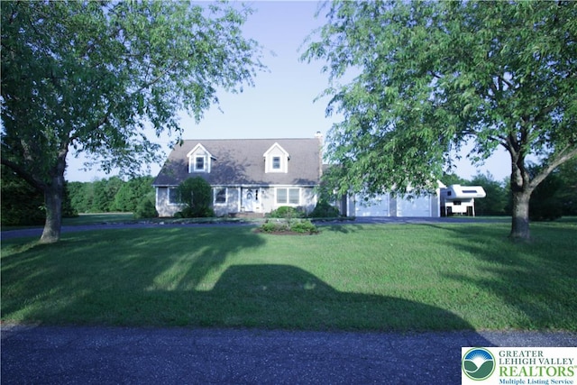 472 Bauer Rd, Moore Twp, PA 18014 - new england style home with a front yard, a garage, and a chimney