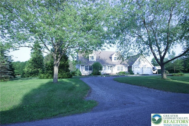 472 Bauer Rd, Moore Twp, PA 18014 - cape cod-style house featuring dirt driveway, a garage, and a front yard