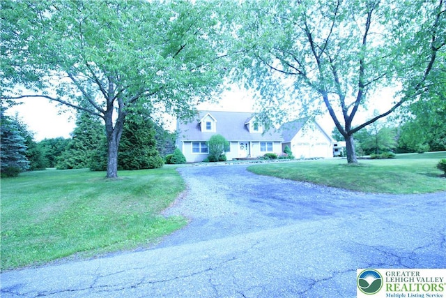 472 Bauer Rd, Moore Twp, PA 18014 - cape cod-style house featuring a front yard and gravel driveway