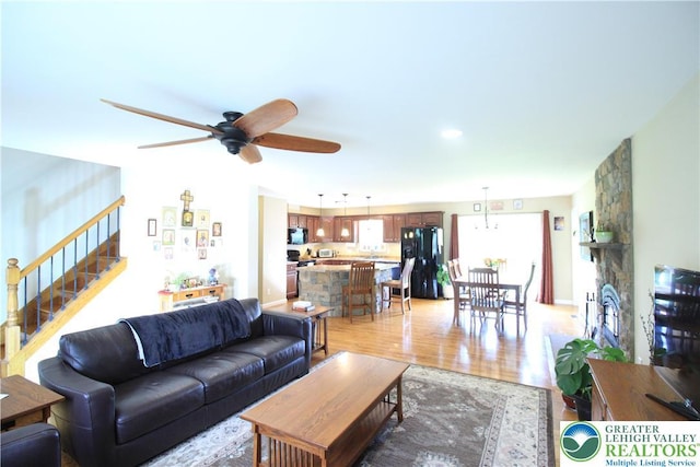 472 Bauer Rd, Moore Twp, PA 18014 - living room featuring ceiling fan, stairs, and light wood-style flooring
