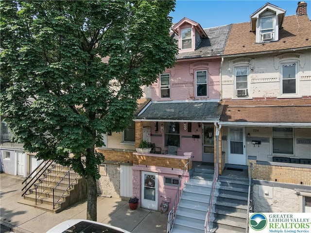718 Jordan St, Allentown City, PA 18102 - view of property with stairs, brick siding, and covered porch