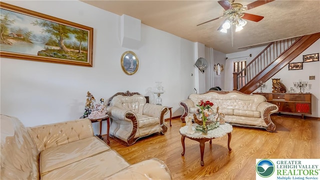 718 Jordan St, Allentown City, PA 18102 - living area with ceiling fan, wood finished floors, and stairs