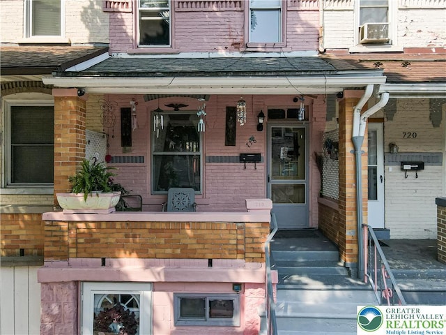 718 Jordan St, Allentown City, PA 18102 - property entrance with a porch, brick siding, and a shingled roof