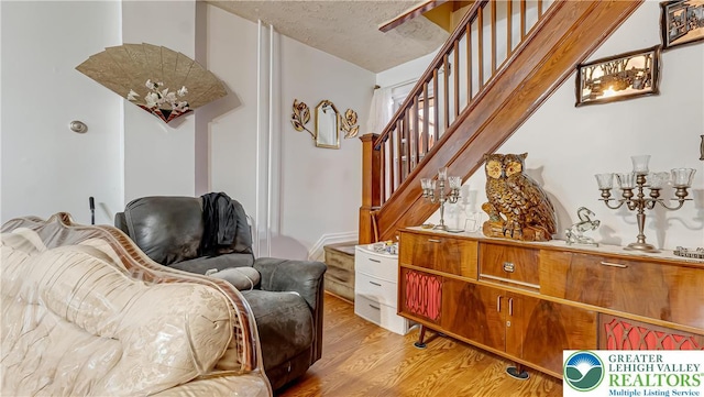 718 Jordan St, Allentown City, PA 18102 - sitting room featuring stairway and light wood-type flooring