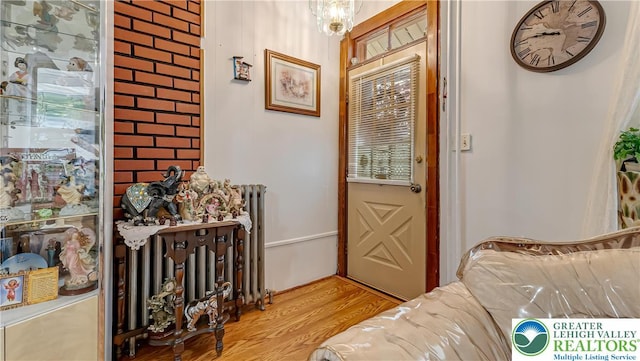 718 Jordan St, Allentown City, PA 18102 - entrance foyer with wood finished floors and radiator heating unit