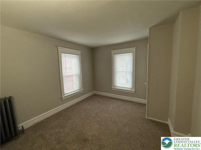 6085 St John St, Allentown City, PA 18103 - unfurnished room featuring plenty of natural light, radiator heating unit, carpet, and baseboards