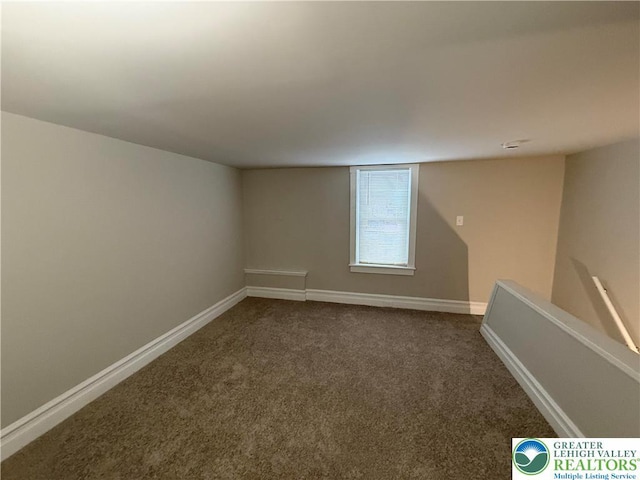 6085 St John St, Allentown City, PA 18103 - spare room featuring dark carpet and baseboards