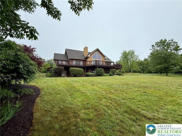 3353 Spring Valley Rd, Washington Twp, PA 18080 - view of front facade featuring a deck, a front lawn, and a chimney