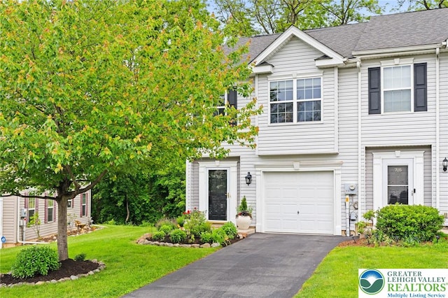 707 Blue Heron Dr, Allentown City, PA 18103 - view of front of home featuring a front yard, driveway, a garage, and roof with shingles