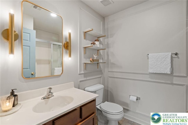 707 Blue Heron Dr, Allentown City, PA 18103 - bathroom featuring vanity, toilet, and an enclosed shower