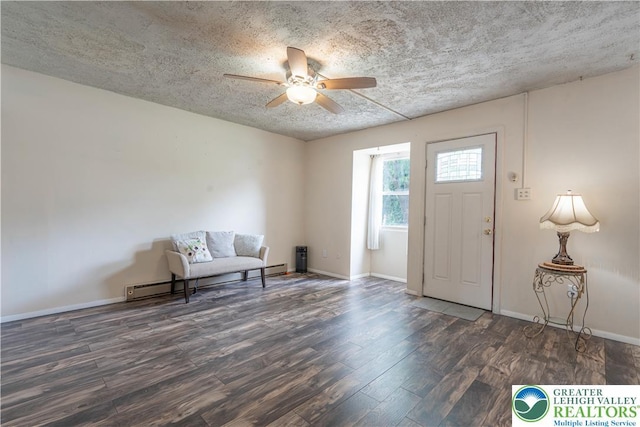 402 Bradford St, Allentown City, PA 18109 - foyer entrance with a ceiling fan, wood finished floors, a baseboard heating unit, a textured ceiling, and baseboards