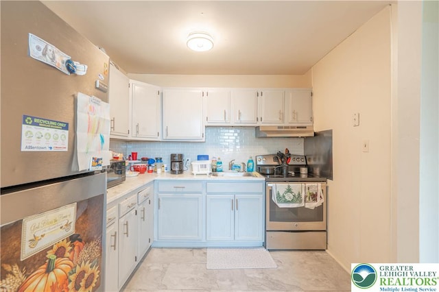 402 Bradford St, Allentown City, PA 18109 - kitchen with stainless steel appliances, under cabinet range hood, tasteful backsplash, light countertops, and white cabinets