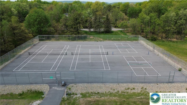 1367 Stony Mountain Rd, Penn Forest Twp, PA 18210 - view of tennis court featuring a forest view
