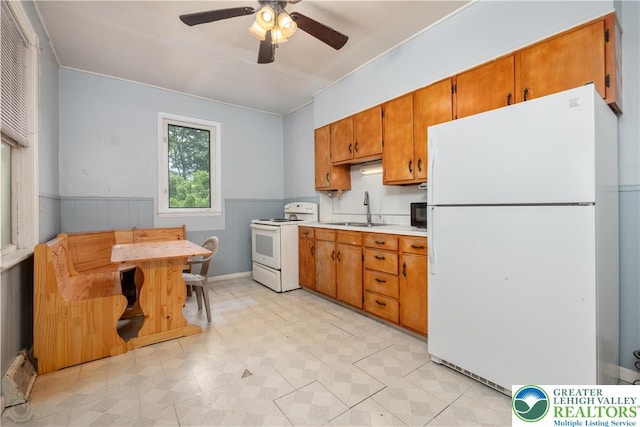 531 E Church St, Slatington Borough, PA 18080 - kitchen with white appliances, a sink, light countertops, ceiling fan, and brown cabinets