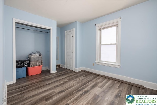 531 E Church St, Slatington Borough, PA 18080 - unfurnished bedroom with wood finished floors, baseboards, and a closet