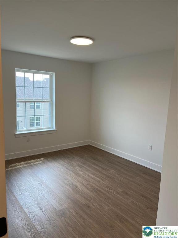 5268 Saddlebred Rd, South Whitehall Twp, PA 18104 - unfurnished room featuring dark wood-style flooring and baseboards