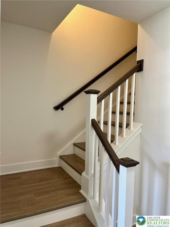 5268 Saddlebred Rd, South Whitehall Twp, PA 18104 - stairs with wood finished floors and baseboards