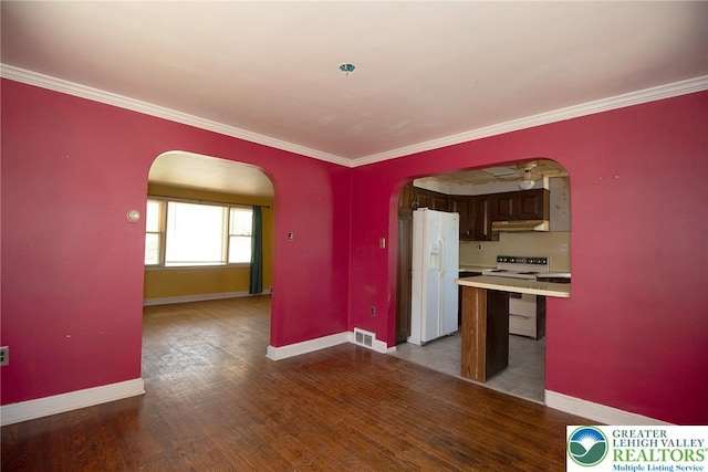 665 Furnace St, Emmaus Borough, PA 18049 - kitchen with arched walkways, white appliances, under cabinet range hood, baseboards, and ornamental molding