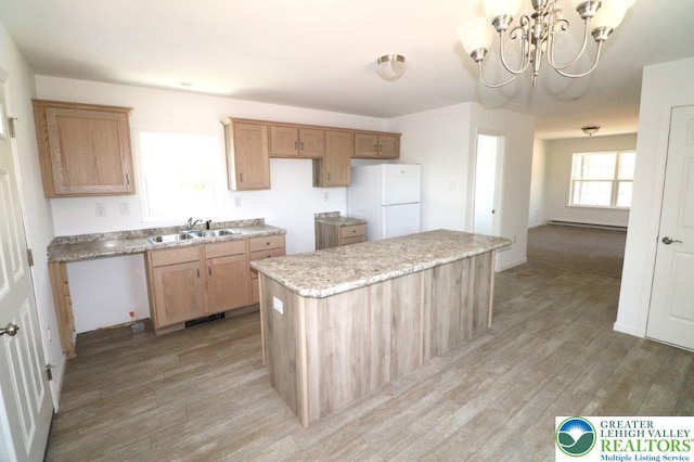 1025 W Princeton Ave, Palmerton Boro, PA 18071 - kitchen featuring freestanding refrigerator, a sink, light wood-style flooring, a center island, and a chandelier