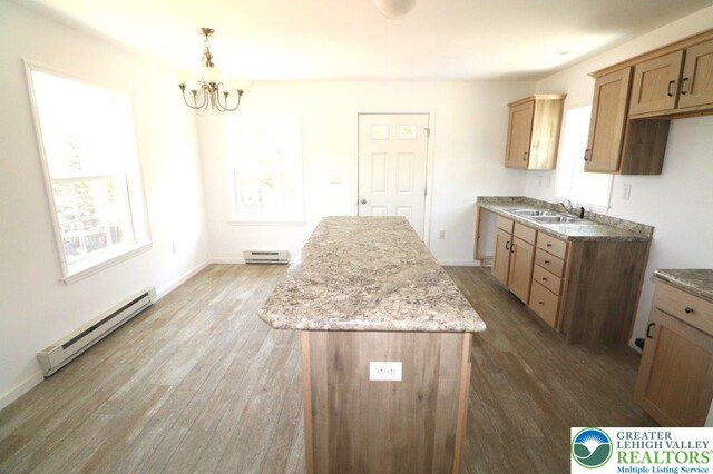 1025 W Princeton Ave, Palmerton Boro, PA 18071 - kitchen with a baseboard heating unit, wood finished floors, and a center island