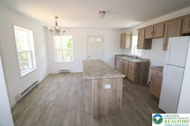 1025 W Princeton Ave, Palmerton Boro, PA 18071 - kitchen with freestanding refrigerator, a baseboard radiator, a chandelier, a sink, and wood finished floors