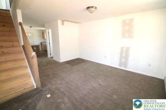 1025 W Princeton Ave, Palmerton Boro, PA 18071 - spare room with stairs, dark carpet, and baseboards