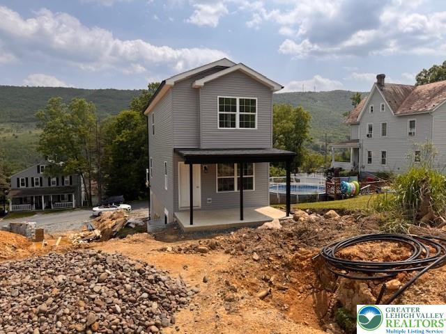 1025 W Princeton Ave, Palmerton Boro, PA 18071 - rear view of property with an outdoor pool and a patio