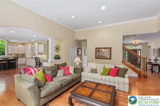 6335 Sweetbriar Ln, Upper Milford Twp, PA 18092 - living room with crown molding, stairway, light wood-style flooring, arched walkways, and recessed lighting